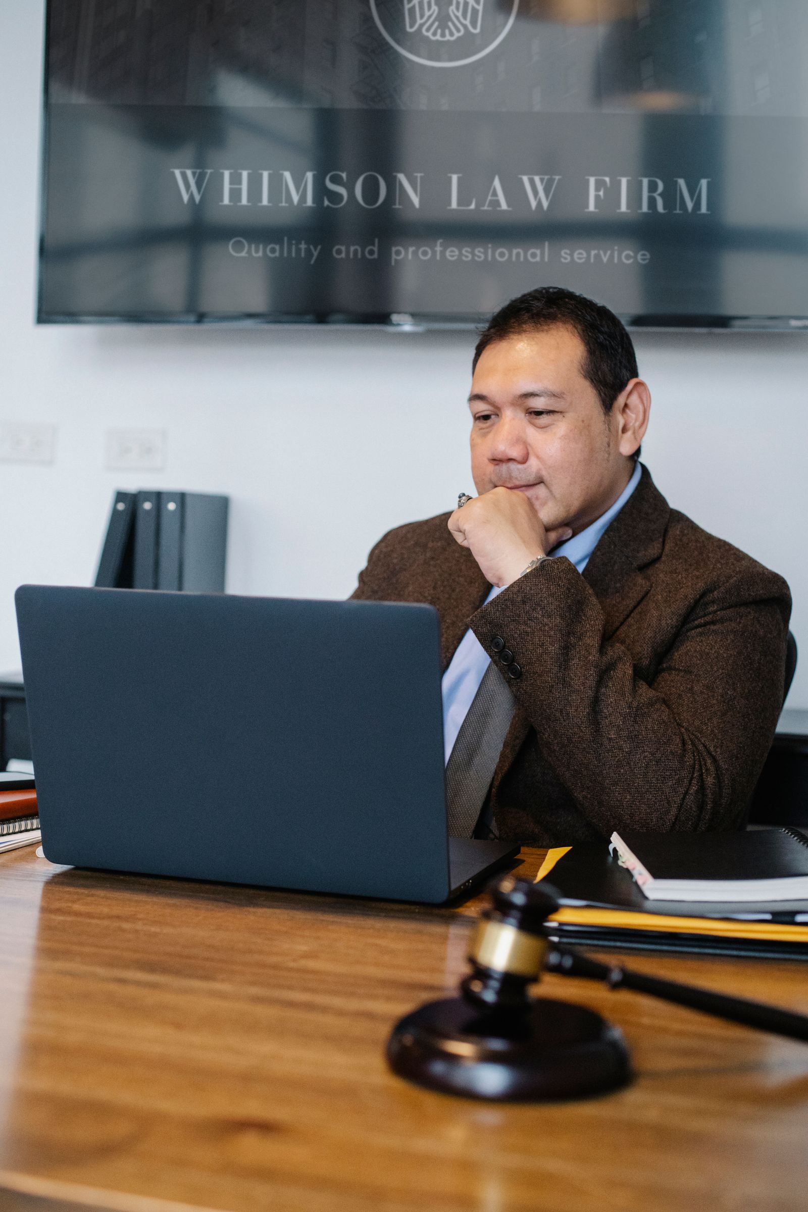 Lawyer using a laptop to manage legal case files digitally