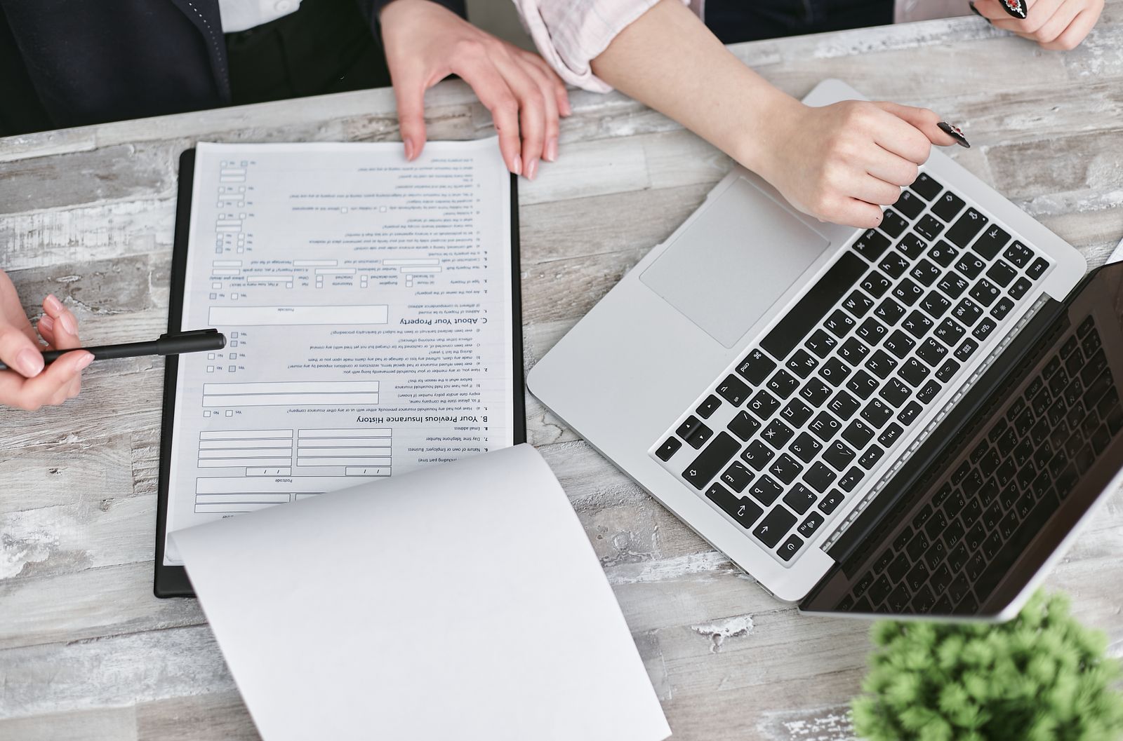 Laptop and financial documents on a modern office desk